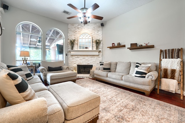 3419 Willowcreek Dr, Sunnyvale, TX 75182 - living area featuring wood finished floors, a ceiling fan, a fireplace, and plenty of natural light