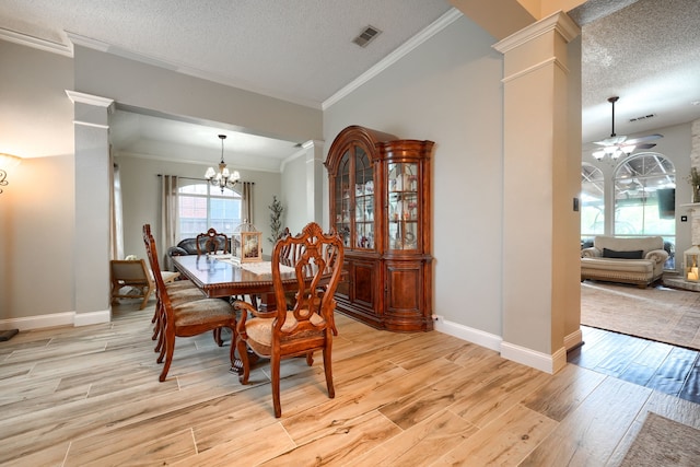 3419 Willowcreek Dr, Sunnyvale, TX 75182 - dining space with decorative columns, ornamental molding, a textured ceiling, and light wood-style flooring