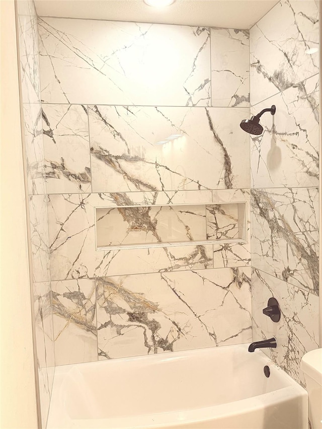 full bathroom with toilet and  shower combination