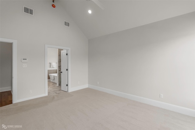 916 Aaron Ln, Benton, LA 71006 - unfurnished bedroom featuring high vaulted ceiling, light colored carpet, connected bathroom, and recessed lighting