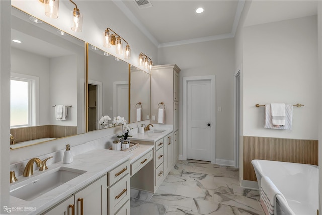 916 Aaron Ln, Benton, LA 71006 - full bath featuring double vanity, a soaking tub, marble finish flooring, recessed lighting, and ornamental molding