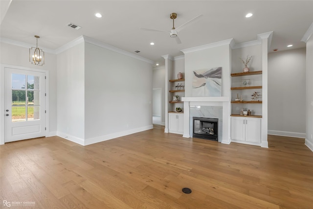916 Aaron Ln, Benton, LA 71006 - unfurnished living room featuring ornamental molding, light wood-style floors, a chandelier, ceiling fan, and recessed lighting