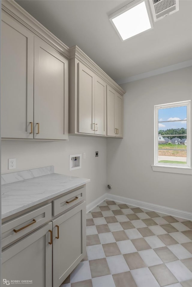 916 Aaron Ln, Benton, LA 71006 - washroom featuring light flooring, cabinet space, hookup for an electric dryer, hookup for a washing machine, and ornamental molding