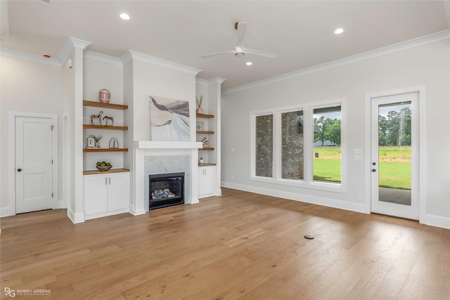 916 Aaron Ln, Benton, LA 71006 - unfurnished living room with crown molding, ceiling fan, a fireplace, light wood-style floors, and recessed lighting