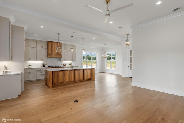 916 Aaron Ln, Benton, LA 71006 - kitchen featuring ornamental molding, recessed lighting, ceiling fan, light wood-style floors, and light countertops