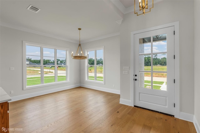 916 Aaron Ln, Benton, LA 71006 - doorway featuring a chandelier, plenty of natural light, light wood-style flooring, and ornamental molding