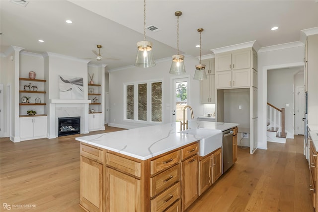 916 Aaron Ln, Benton, LA 71006 - kitchen with a ceiling fan, ornamental molding, light stone countertops, dishwasher, and light wood-type flooring