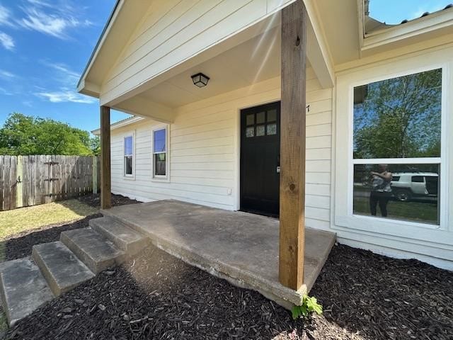 317 W Elm St, Whitewright, TX 75491 - doorway to property featuring a patio area