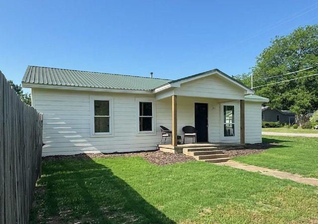 317 W Elm St, Whitewright, TX 75491 - view of front of house featuring a porch and metal roof
