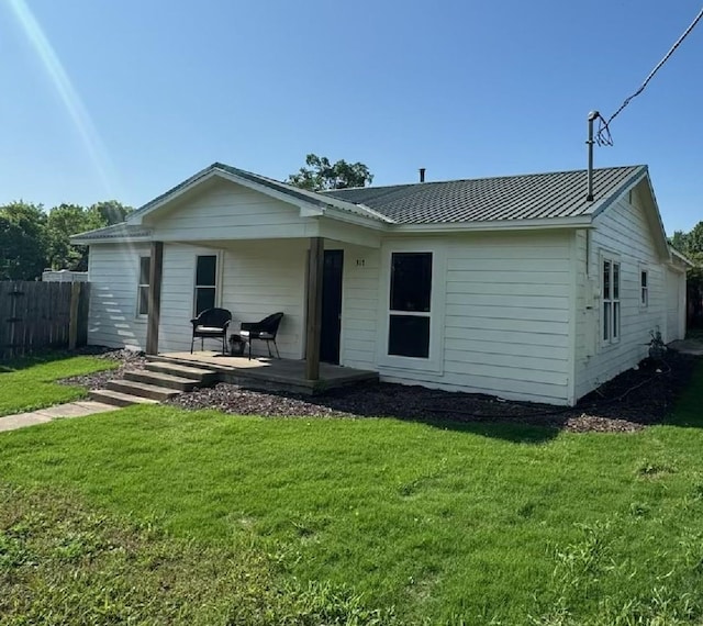 317 W Elm St, Whitewright, TX 75491 - back of house with metal roof