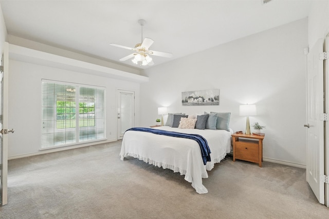 carpeted bedroom featuring baseboards and a ceiling fan
