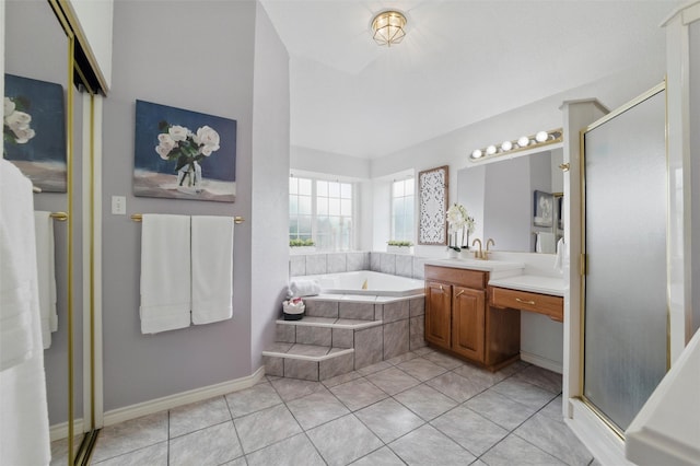 bathroom featuring a garden tub, tile patterned flooring, a stall shower, and vanity