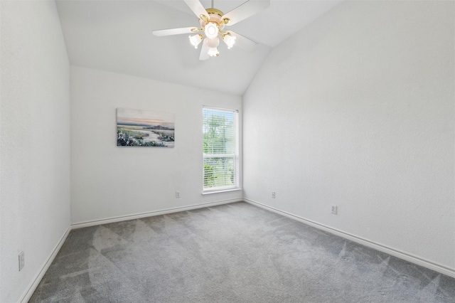 unfurnished room with carpet floors, a ceiling fan, baseboards, and lofted ceiling