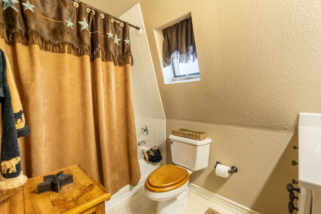 12282 Fm 1392, Terrell, TX 75160 - full bathroom featuring shower / bath combination with curtain, toilet, a textured wall, vanity, and tile patterned flooring