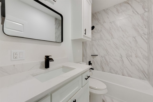 full bath featuring toilet, vanity, and shower / washtub combination