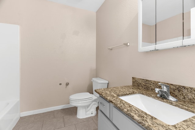 full bath featuring tile patterned flooring, a washtub, toilet, vanity, and baseboards