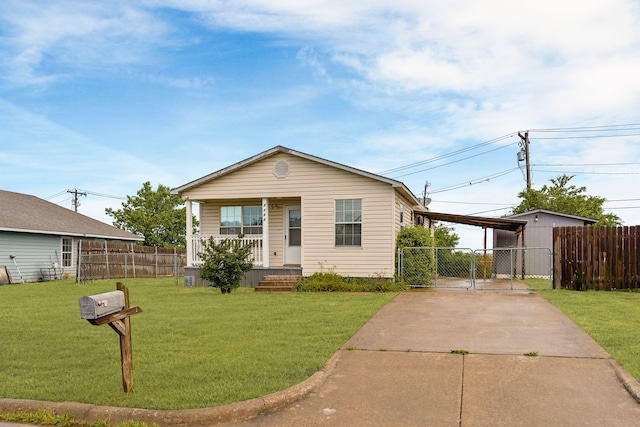 bungalow-style home with a gate, fence, a front lawn, concrete driveway, and covered porch