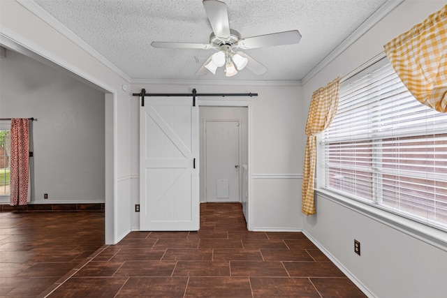 3206 Knights Haven Ln, Garland, TX 75044 - unfurnished bedroom with multiple windows, a textured ceiling, a barn door, crown molding, and a ceiling fan