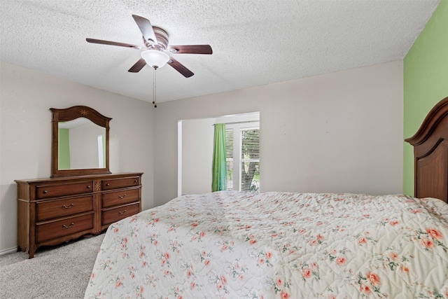 3206 Knights Haven Ln, Garland, TX 75044 - bedroom featuring light colored carpet, a textured ceiling, and ceiling fan