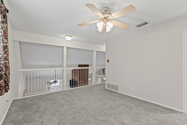 3206 Knights Haven Ln, Garland, TX 75044 - carpeted empty room featuring a ceiling fan, a textured ceiling, and baseboards