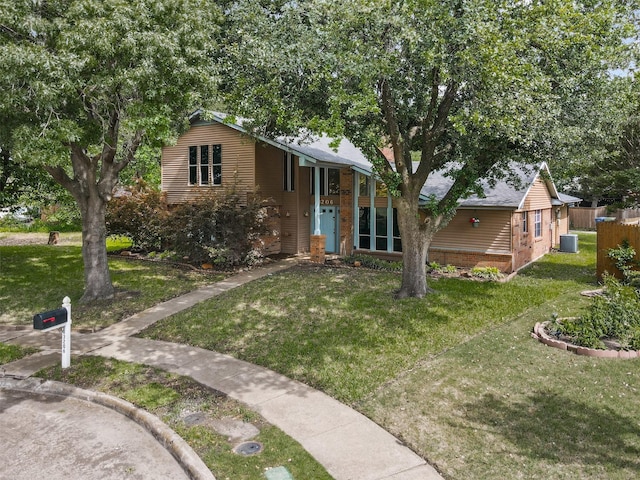 3206 Knights Haven Ln, Garland, TX 75044 - view of front facade featuring cooling unit and brick siding
