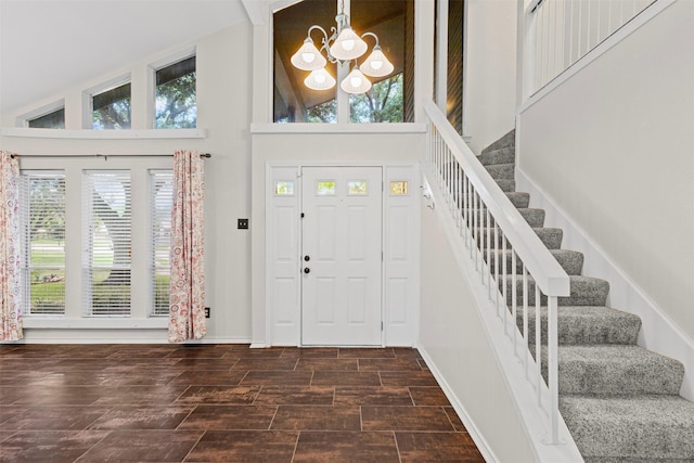 3206 Knights Haven Ln, Garland, TX 75044 - entryway featuring a chandelier, plenty of natural light, a towering ceiling, and stairs