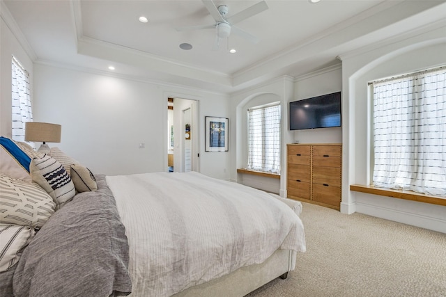 bedroom featuring carpet, a raised ceiling, recessed lighting, and ornamental molding