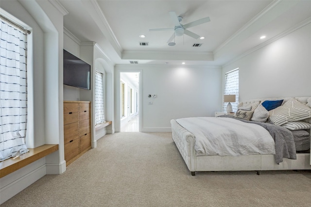 bedroom with crown molding, visible vents, and light carpet