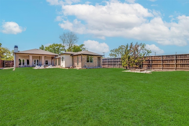 view of yard with a fenced backyard
