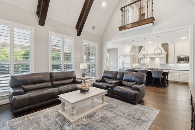 living area featuring high vaulted ceiling, dark wood finished floors, beam ceiling, and recessed lighting