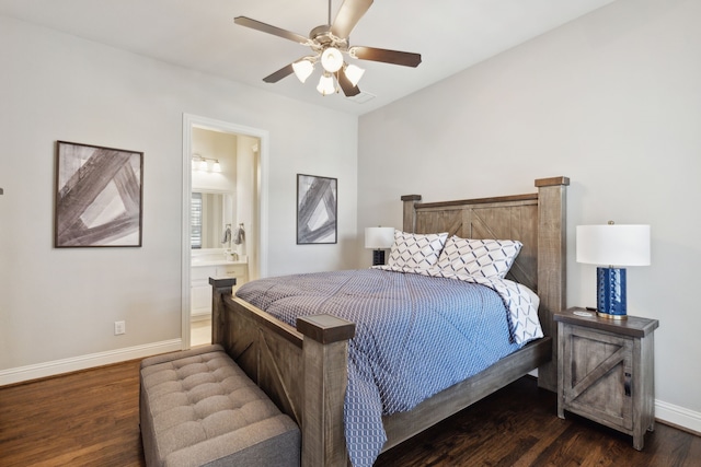 bedroom with ensuite bath, wood finished floors, baseboards, and ceiling fan