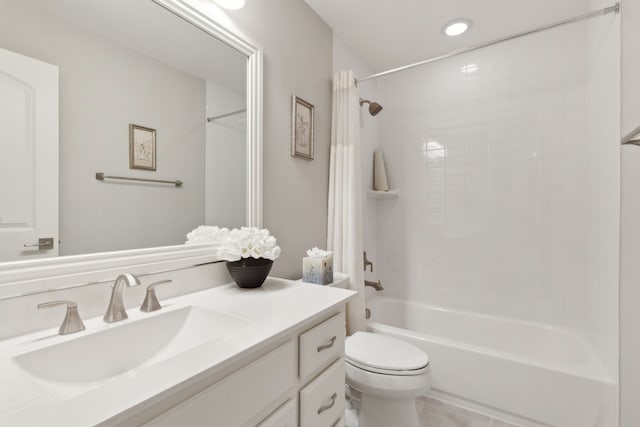 full bath featuring shower / bath combo, vanity, recessed lighting, and toilet