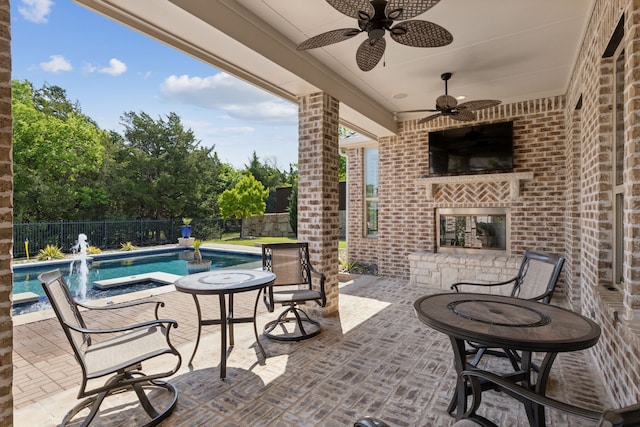 view of patio / terrace featuring a fenced backyard, a ceiling fan, and a fenced in pool