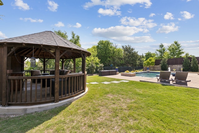 view of yard featuring a fenced backyard, a gazebo, and a fenced in pool