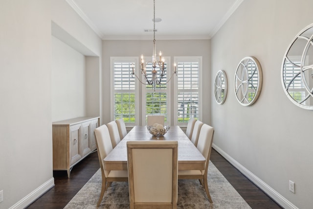 dining space with an inviting chandelier, ornamental molding, dark wood-type flooring, and visible vents