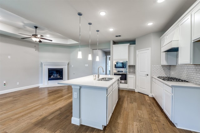 1624 Sweetwater Way, Celina, TX 75009 - kitchen featuring stainless steel appliances, ceiling fan, open floor plan, backsplash, and light countertops