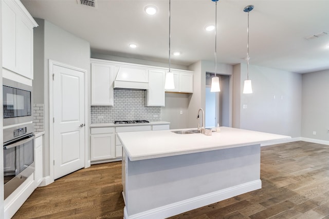 1624 Sweetwater Way, Celina, TX 75009 - kitchen featuring oven, black microwave, backsplash, dark wood-style floors, and recessed lighting