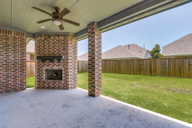 1624 Sweetwater Way, Celina, TX 75009 - fenced backyard with an outdoor brick fireplace, a patio area, and a ceiling fan