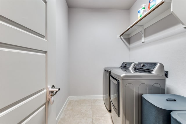 4737 Tanglewood Dr, Haltom City, TX 76137 - laundry area featuring light tile patterned floors, baseboards, separate washer and dryer, and laundry area