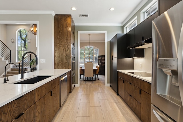 kitchen with visible vents, recessed lighting, appliances with stainless steel finishes, under cabinet range hood, and a sink