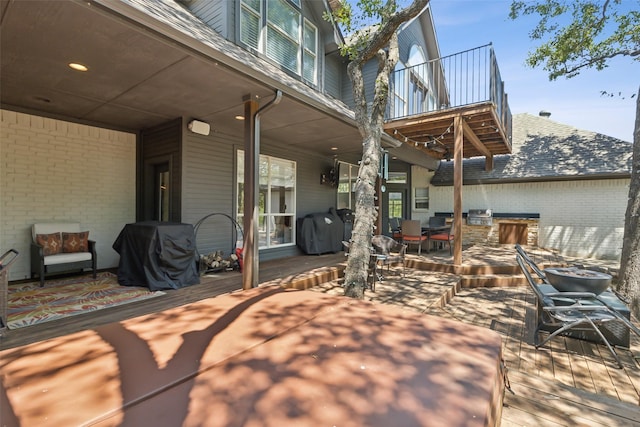view of patio with a grill and outdoor dining area