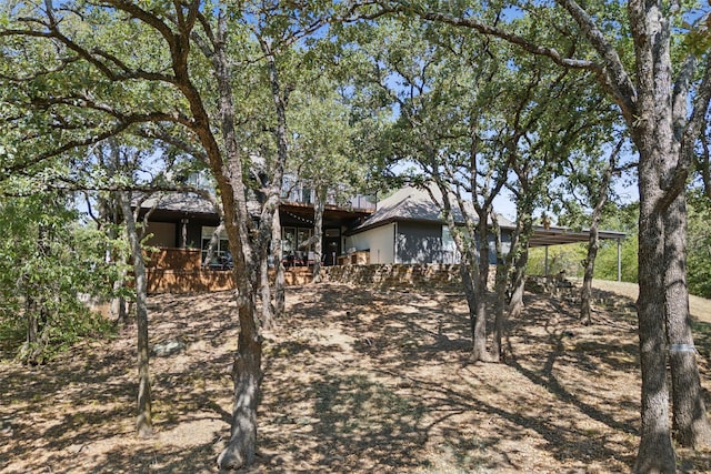 exterior space with a carport