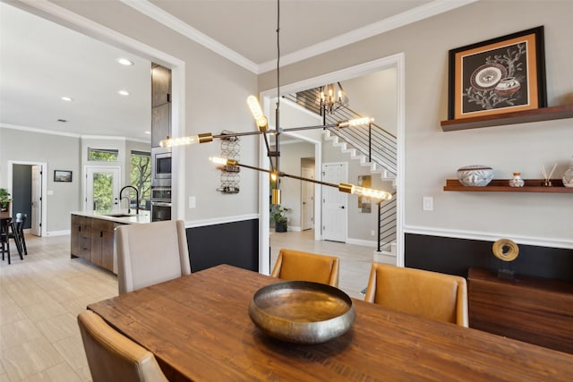 dining space featuring an inviting chandelier, ornamental molding, recessed lighting, stairway, and baseboards