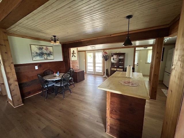 239 Ranch Rd, Joshua, TX 76058 - dining room featuring french doors, wooden ceiling, wood finished floors, and wood walls