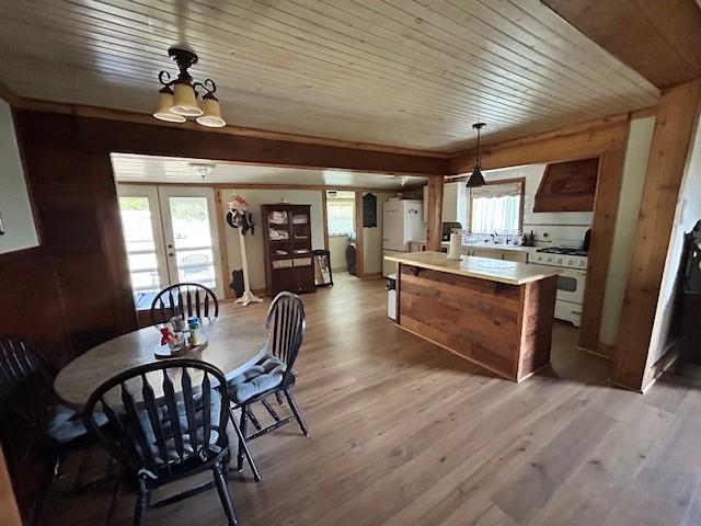 239 Ranch Rd, Joshua, TX 76058 - dining space featuring wood ceiling, light wood finished floors, and french doors