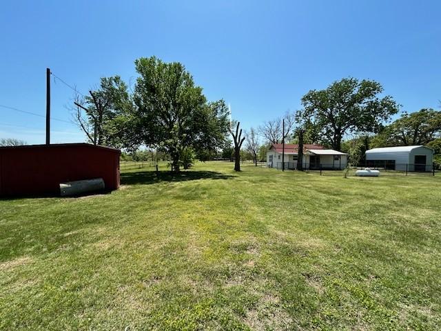 239 Ranch Rd, Joshua, TX 76058 - view of grassy yard with an outbuilding