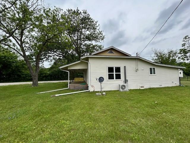 239 Ranch Rd, Joshua, TX 76058 - view of side of home with a lawn and a cooling unit