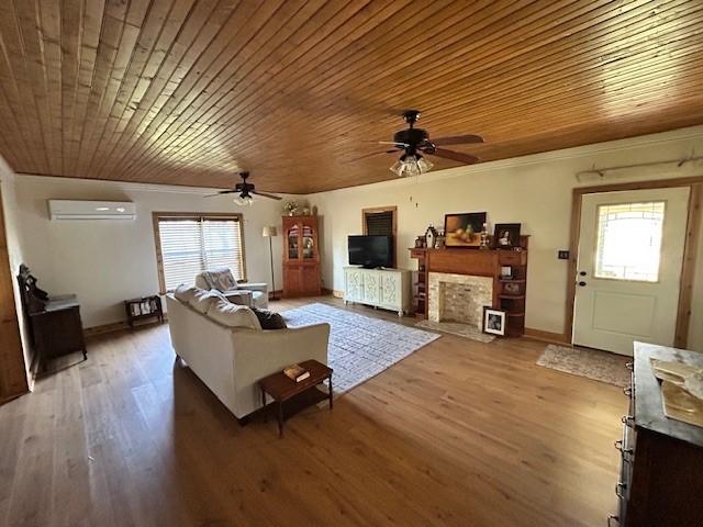 239 Ranch Rd, Joshua, TX 76058 - living area featuring a ceiling fan, wood ceiling, an AC wall unit, light wood-style floors, and ornamental molding