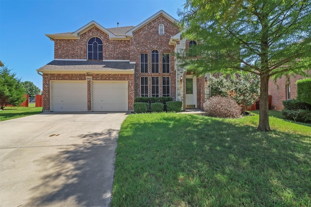 traditional-style house with an attached garage, concrete driveway, a front lawn, and brick siding