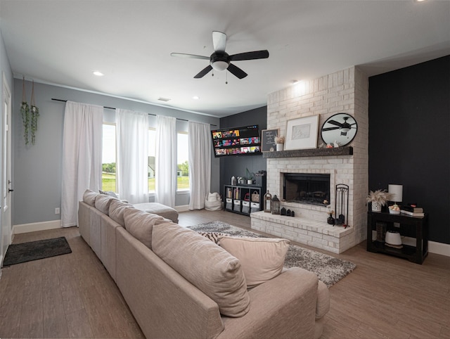 1515 Malone Dr, Royse City, TX 75189 - living room featuring ceiling fan, wood finished floors, a brick fireplace, and baseboards